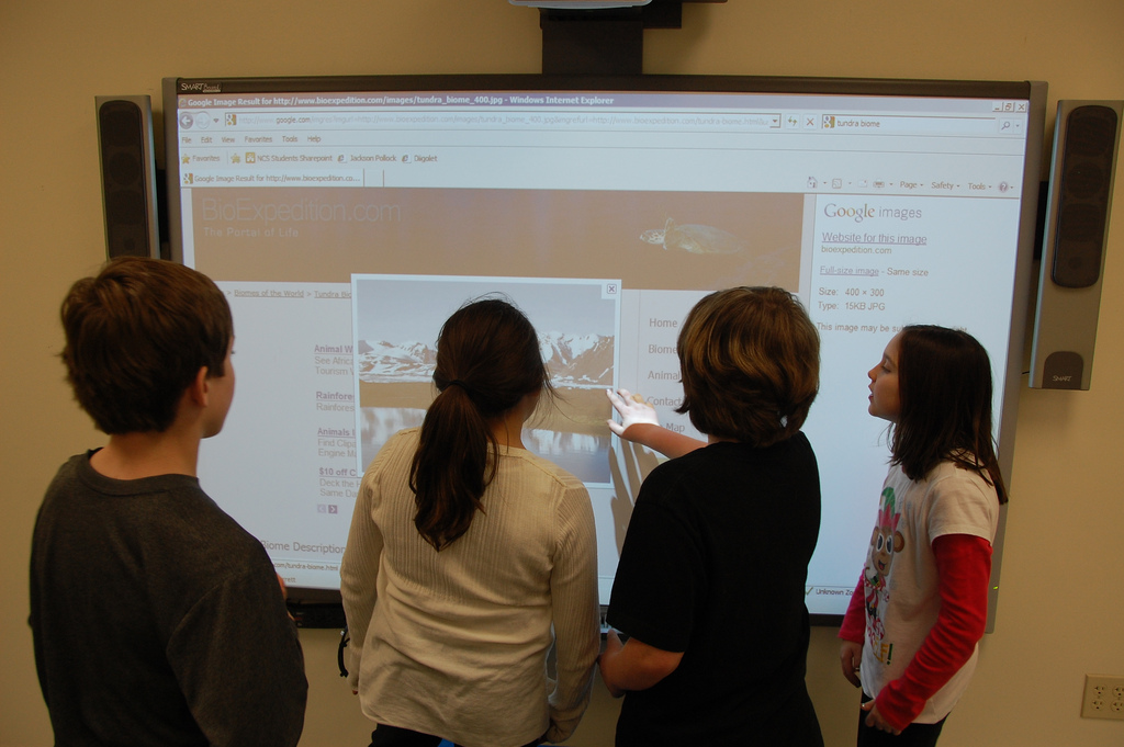 Several students can interact with interactive display at the same time